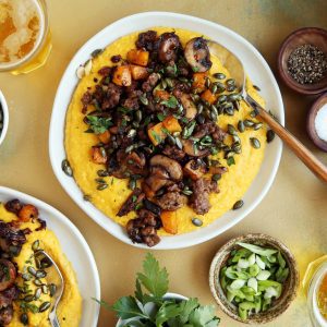 Cheesy Pumpkin Grits with Sausage, Mushrooms and Butternut Squash